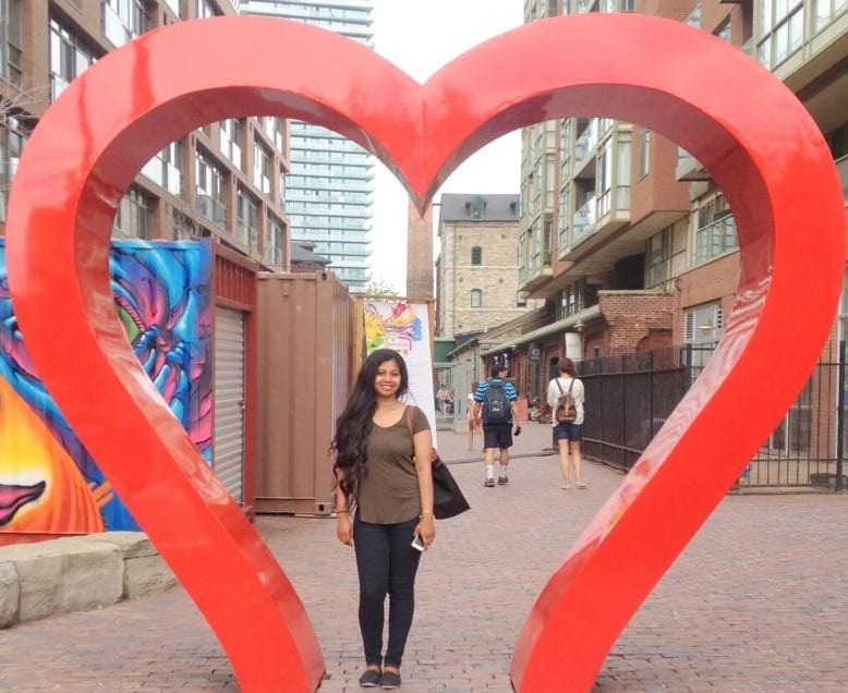Pran standing in a giant heart